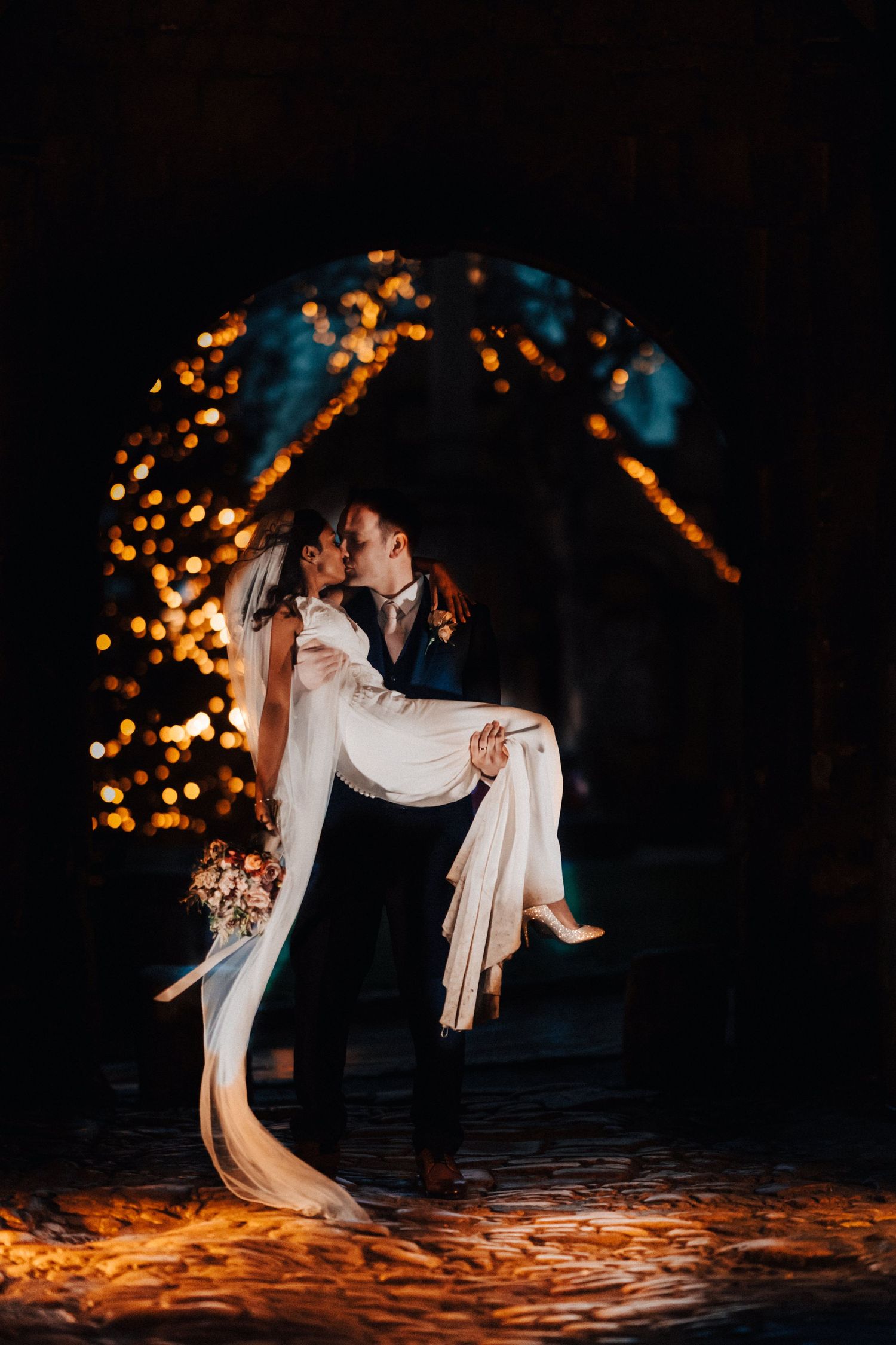 Bridal Kissing The Groom Taken in The Cotswolds